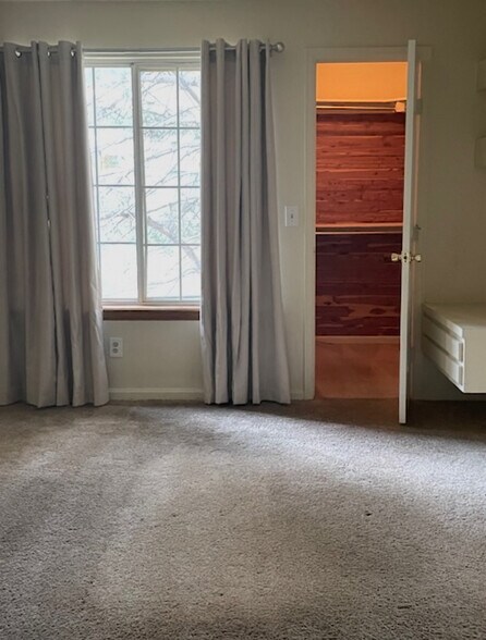 Large bedroom overlooking open space with walk in cedar closer - 6036 Gunbarrel Ave