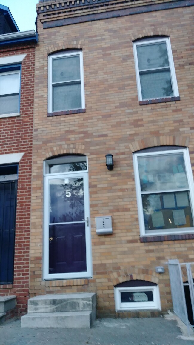 Front View with Storm Door, Mailbox, Security Light (before construction stickers were removed) - 5 N Caroline St