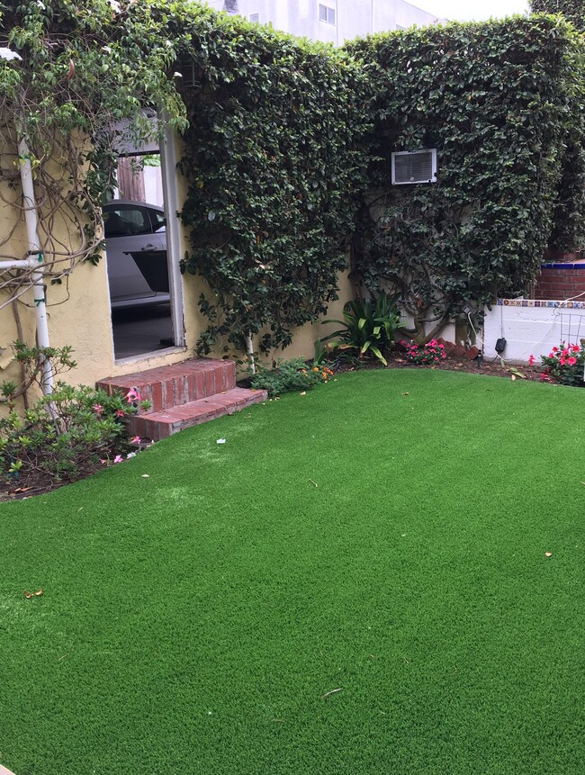 Rear lawn and entry into two car garage - 826 21st St