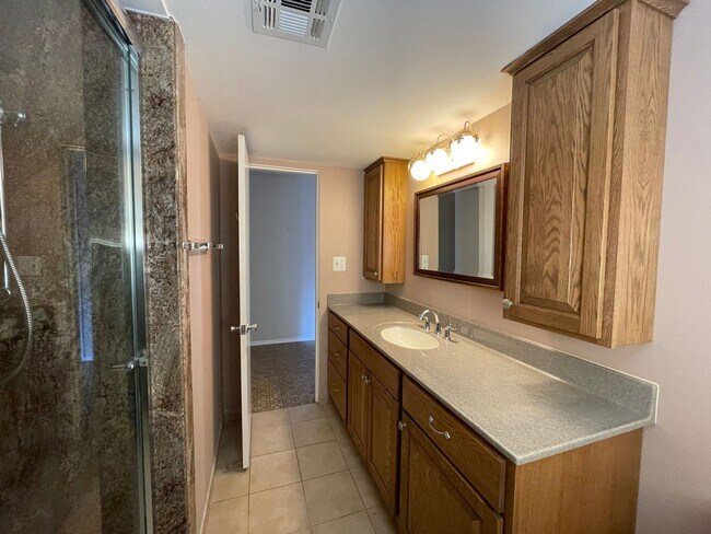 Building Photo - 3 bedroom, 2 bath, 2 living areas, 2 car garage Ranch style home nestled on a corner lot