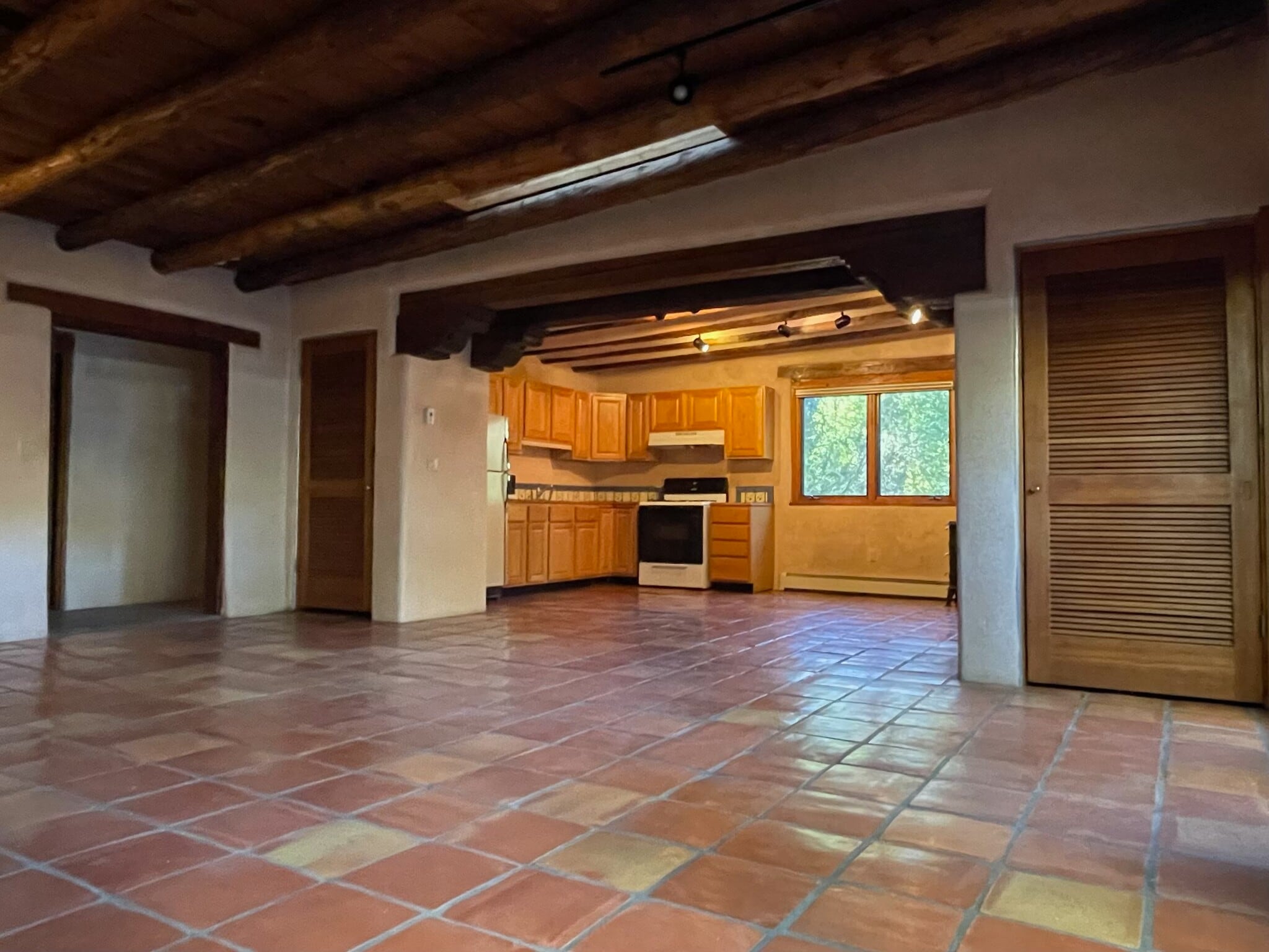 Living Room with vigas and corbels and 2 closets - 1470B Bishops Lodge Rd