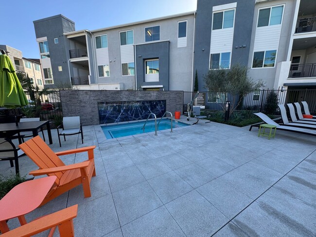 Building Photo - Brand New 1 bedroom, 1 bath Townhome with 2 car tandem garage for lease