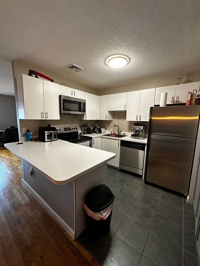 Building Photo - No Brokers Fee!! Spacious 2-Bed, 2-Bath Condo with 2 Parking Spots in Medford