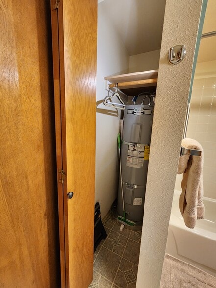 Coat closet with newer water heater - 9645 Independence Dr