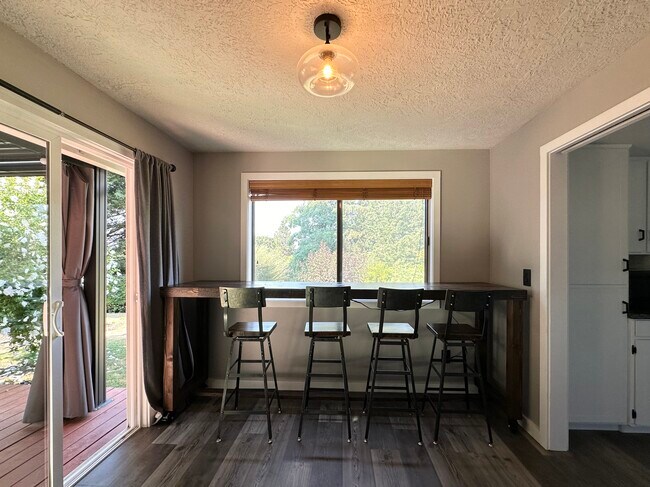 Custom bar seating with outlets overlooking garden - 2345 Century Ln