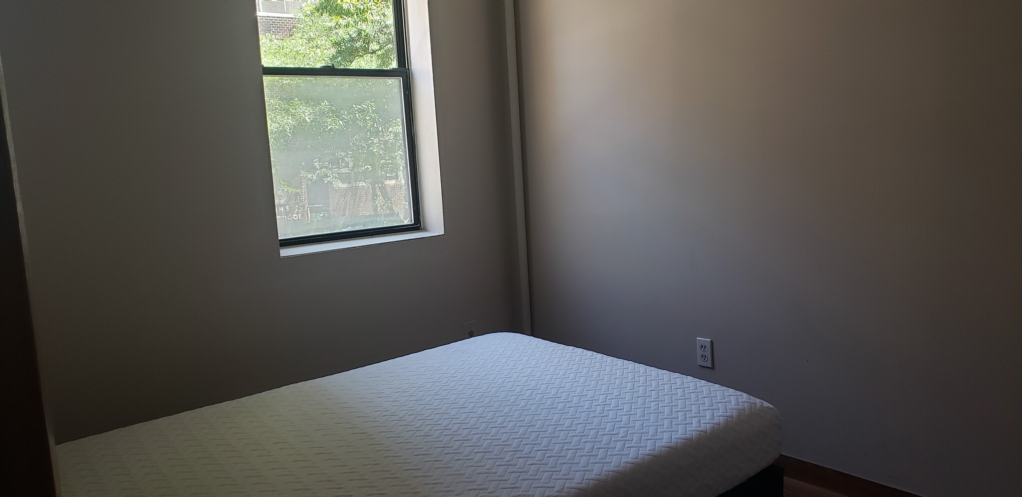Bright window in bedroom - 240 E 23rd St