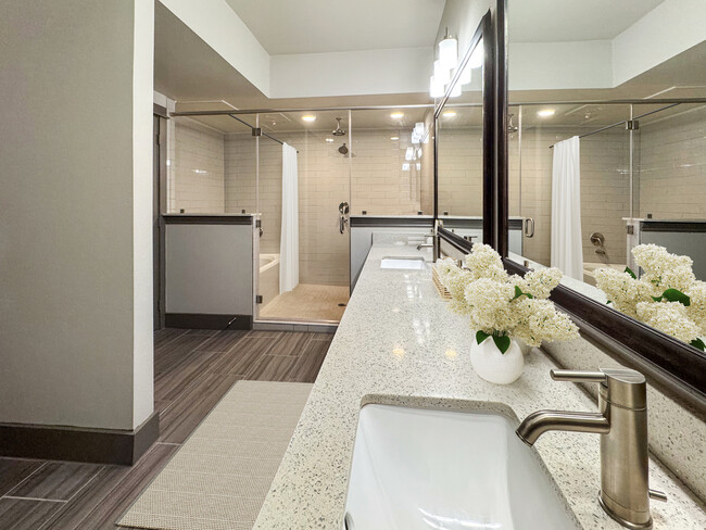 Experience relaxation in this contemporary bathroom, designed with style and luxury in mind. - Midtown Houston Living