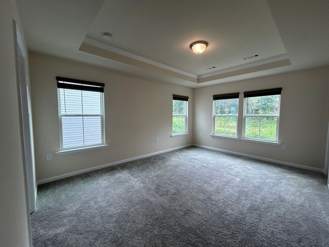 Building Photo - Stunning end-unit newly built 3 bedroom 2....