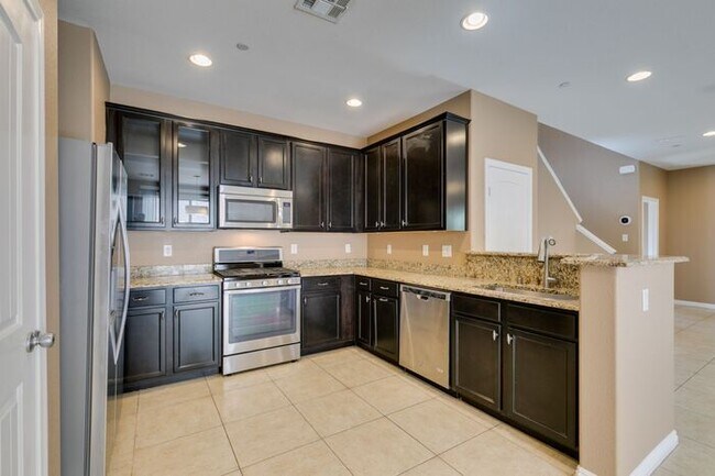 Building Photo - Better Than New with Stunning Designer Upgrades Throughout!