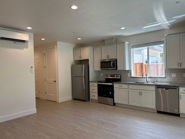 Building Photo - Coming soon! Lower unit  2 bed 1 bath townhome with attached garage