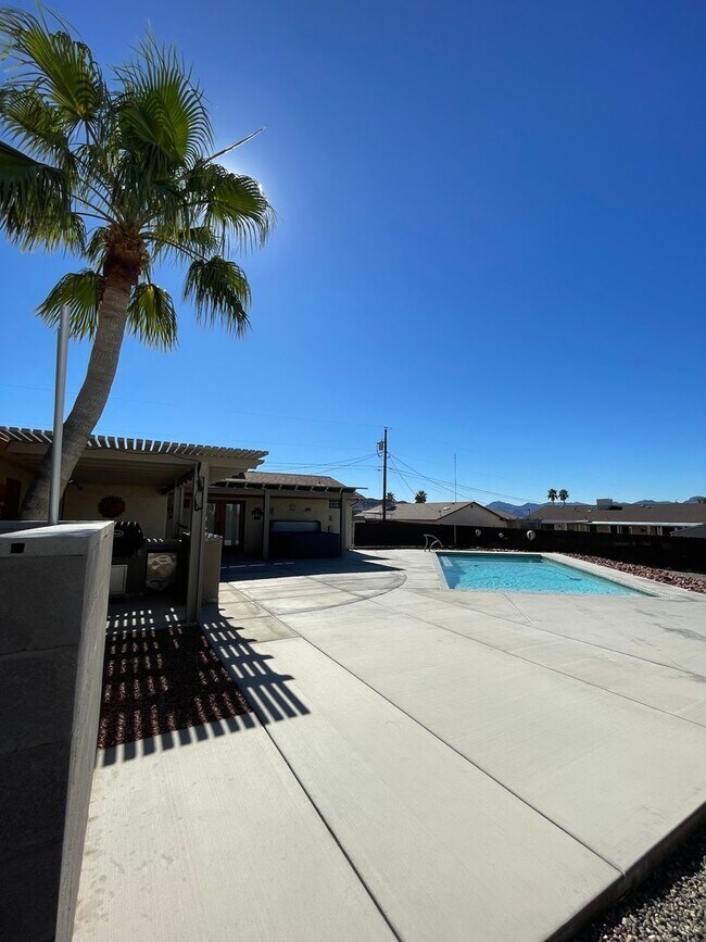 Building Photo - OWNER'S SUMMER SPECIAL-$300 OFF first 3 months! Sparkling Pool Home!