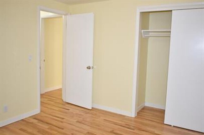 Building Photo - Updated house with original hardwoods and 2-car garage!