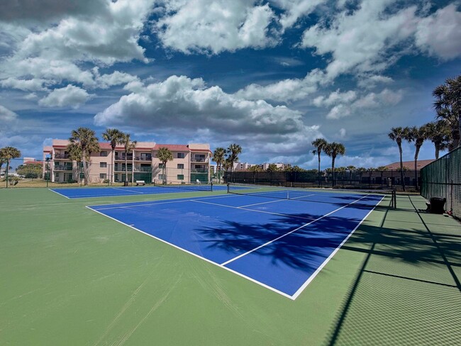 Building Photo - Beautifully Renovated, Fully Furnished Beach Condo just a short walk from the ocean.