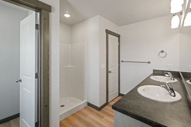 Building Photo - Pet Friendly! Gorgeous 3 Bedroom condo with double stall attached garages with AC.