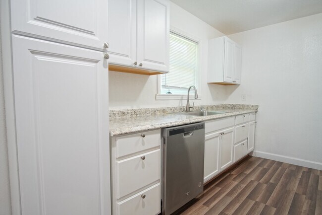 Building Photo - 4BR Home with LVP Flooring, Open Layout & Large Backyard Near Dogwood