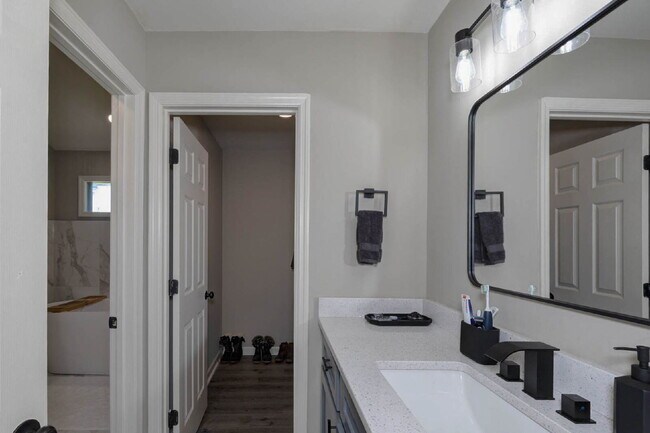 Building Photo - COMING SOON · Designer Renovation · Covered Deck Pavilion · 2-Car Garage · Lawn Care Included
