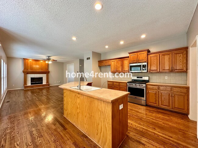 Building Photo - Beautiful Four-Bedroom Home with Three Car Garage, Wood Floors, Finished Basement and a Fenced Ya...