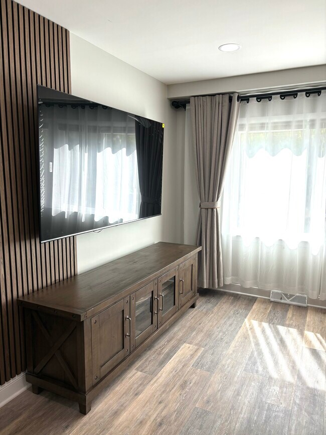 Living room with luxury window treatment - 506 Forest Ave