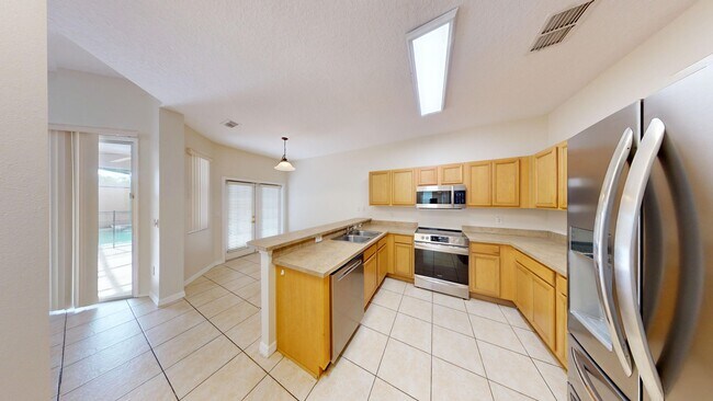 Building Photo - 4BR/4BA - POOL HOME     Calabay Park at To...