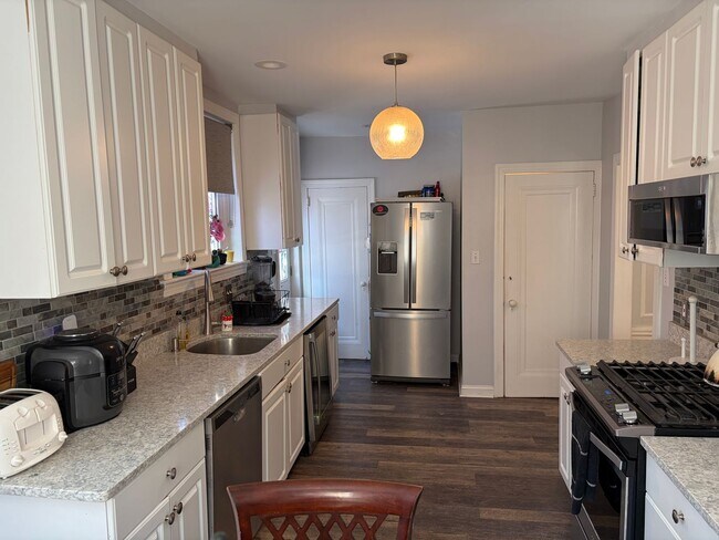 Building Photo - Elegant 3 Story Brick Corner Property Now Available