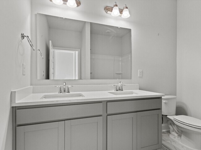 Building Photo - 3 Car Garage! Modern end-unit townhome located in the desirable Clift Farm!