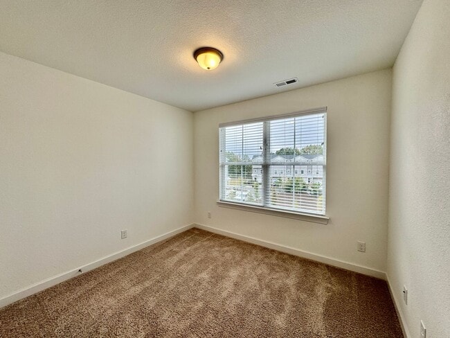 Building Photo - Practically New & Available NOW! Americana Luxury Townhomes! Pet Friendly! Attached Garage! All A...