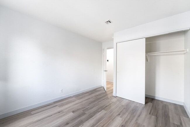 Building Photo - Upgraded Three-Bedroom Condo with Wood Flooring and Modern Comforts!