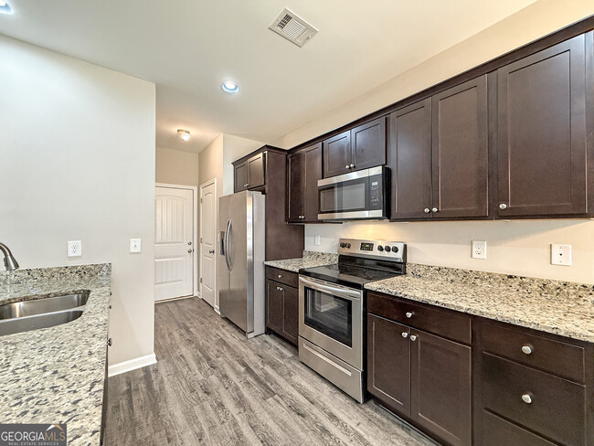 Building Photo - 6369 Woodland Station Dr