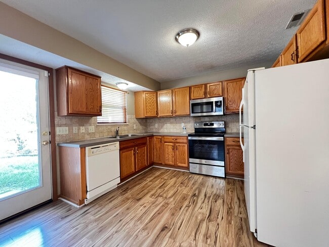 Building Photo - 6171 Womersley Dr
