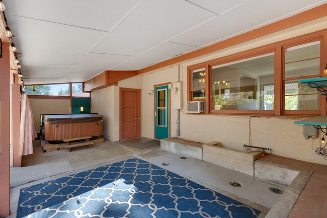 Indoor/Outdoor covered porch area just off the kitchen and living room for dining, hot tub, BBQ. - 114 N Foote Ave