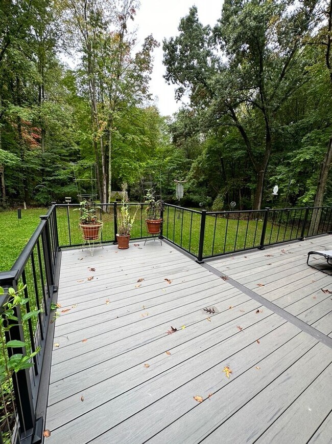 Building Photo - Dream Home in Highland, Michigan: Your Private Oasis on 5 Wooded Acres