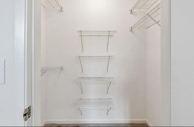 Building Photo - Beautiful & spacious 1 bedroom  updated condo with private patio and covered parking.