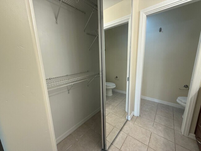 Building Photo - Upgraded Condo with Private Patio, AC, Pool, Gym, and Covered Parking in Gated Community