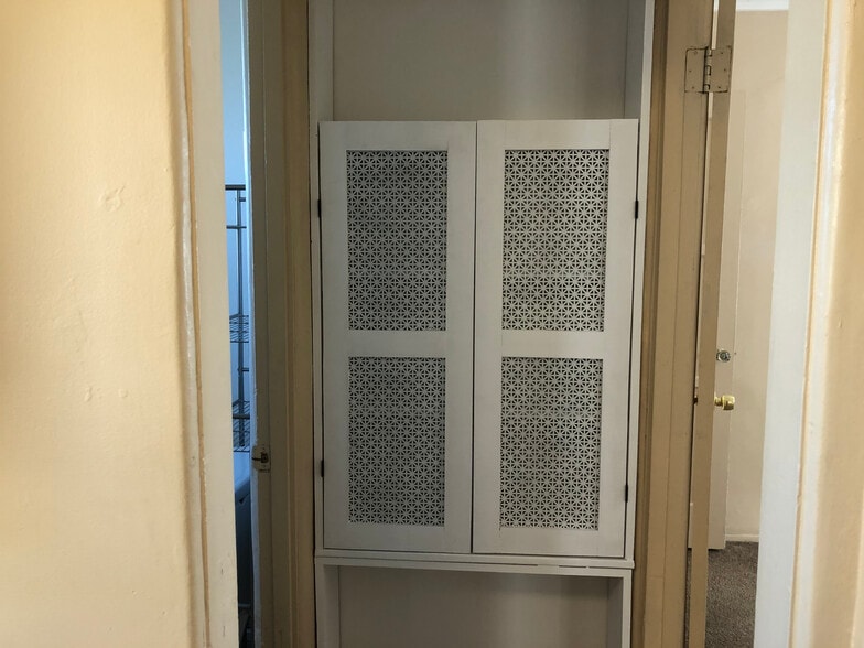 Custom-built hall cubby for storage - 6432 Smoketree Ave