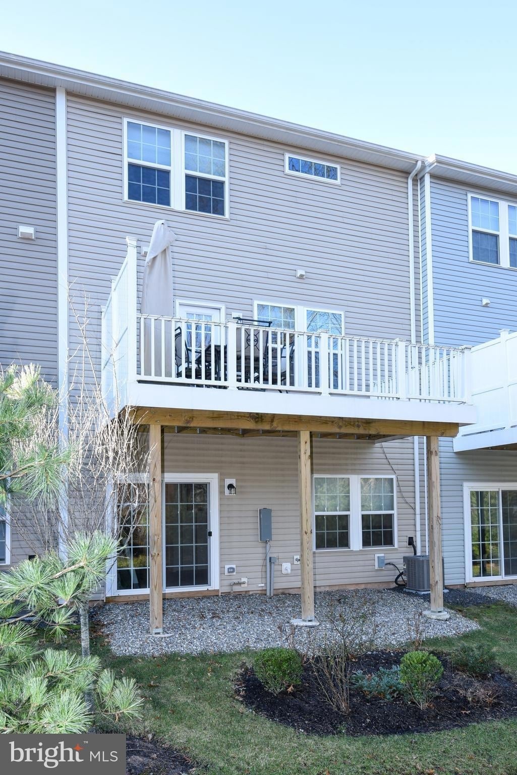 Elevated deck off the main living area for outdoor dining and relaxation. - 1736 Beacon Ln