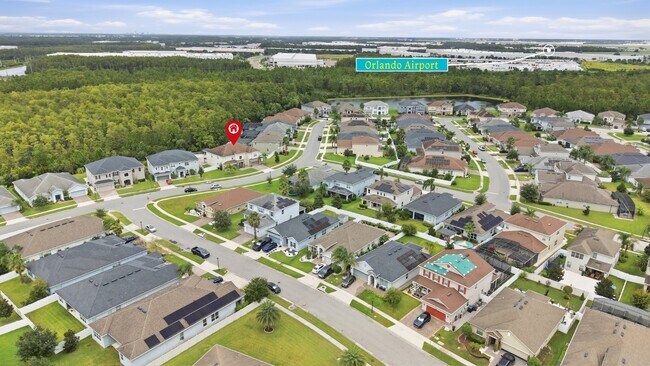 Building Photo - Spacious 6-Bedroom Home Near Lake Nona | 3-Car Garage + Tesla Charger