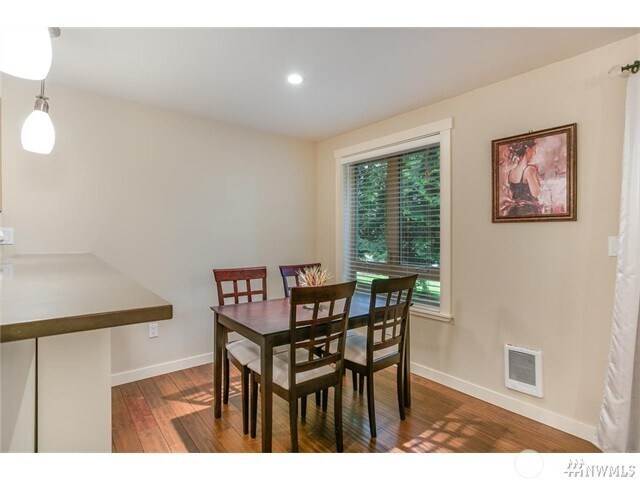 Spacious Dining Room boasts a high top counterspace for Stools/ Use this dining space as an office? - 15140 NE 82nd St