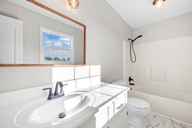 Building Photo - Charming Brick Home with Soaring Ceilings & Updated Finishes!