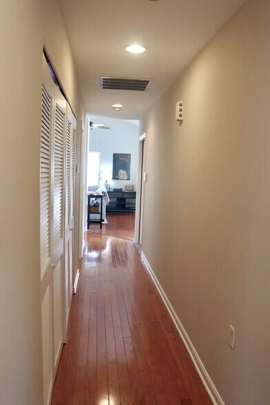 Hallway to living room, washer & dryer in the closer - 4129 Ballard Ave