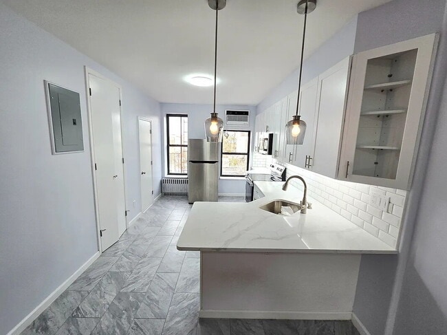 Building Photo - sunny, renovated, rent-stabilized one-bedroom apartment