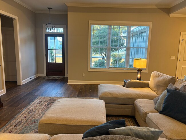 Building Photo - Spacious 4BR/3BA Creekside West Home with Screened Porch, Fenced Yard & 3-Car Garage