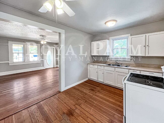 Building Photo - Deck the halls or the French doors, because this charming century-old single family home is avail...