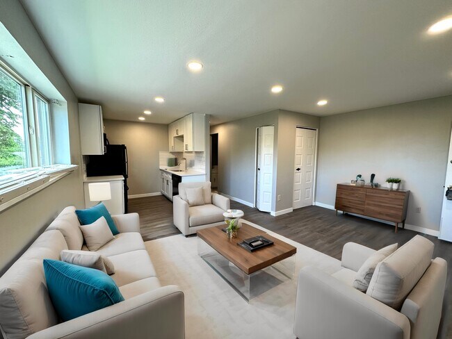 Explore the elegance of this contemporary living space, offering a seamless flow into the kitchen. - Country Club