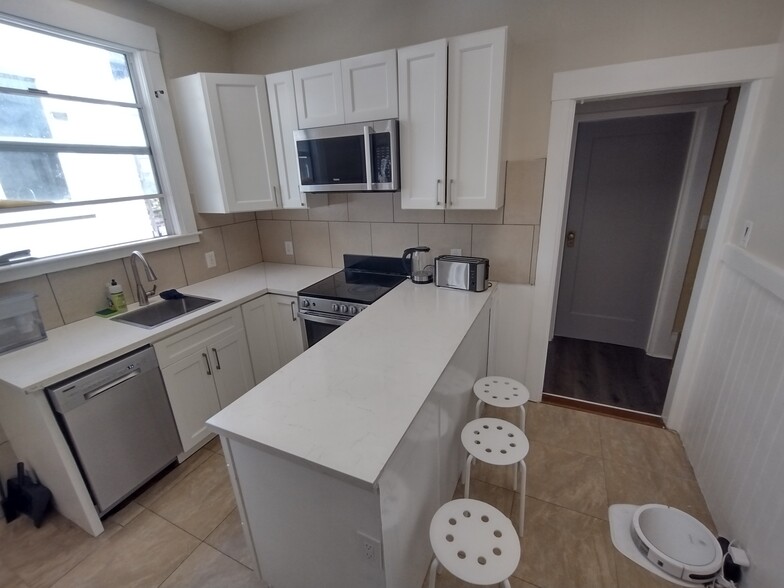 Remodeled kitchen and peninsula table - 2345 Fulton St