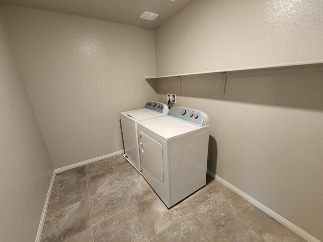Building Photo - A Fairly New Home with 5 Bedrooms in a gated community