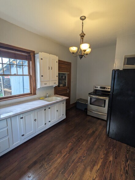 Kitchen Area - Stove & Fridge Included - 214 W 10th Ave