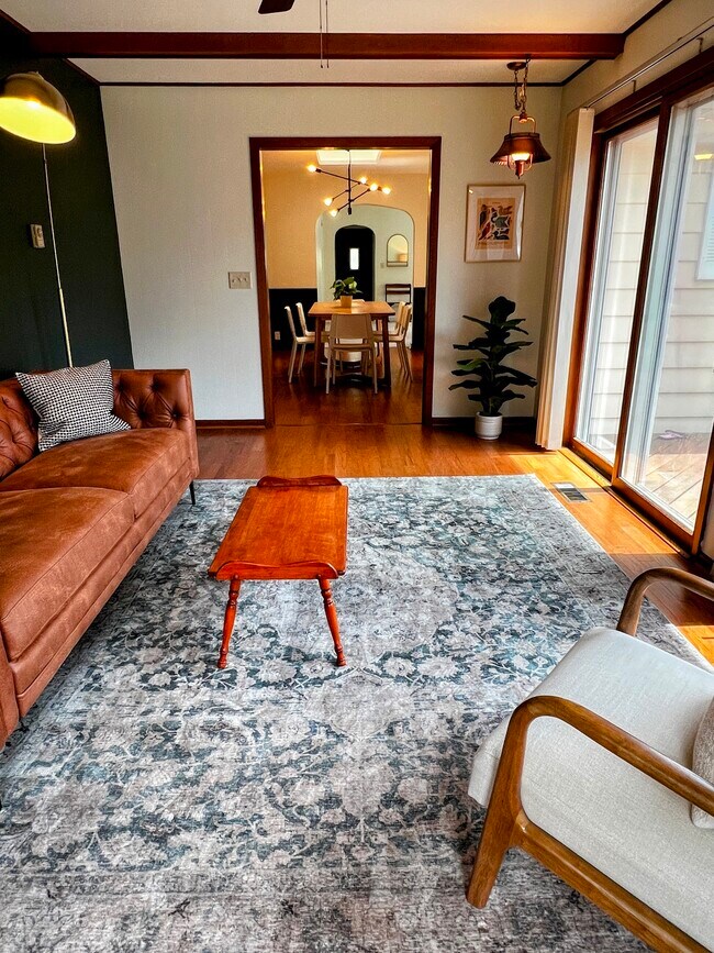 A sliding glass door opens from the study onto the back deck. - 228 W Lexington Blvd