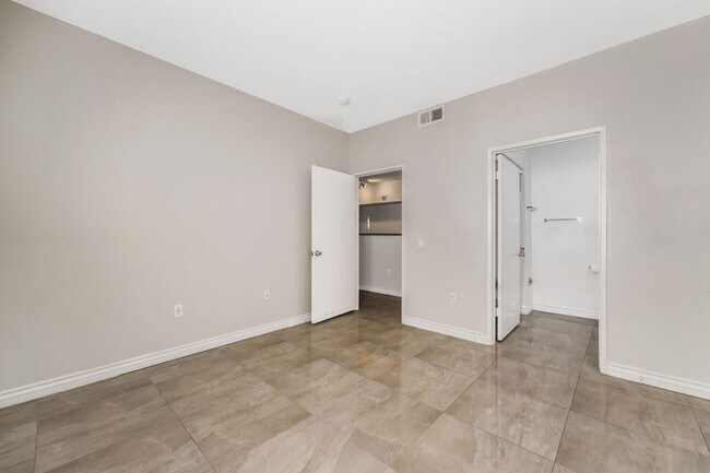 Building Photo - Modern Gated Condo with Upgraded Interior and Attached Garage in Prime South Las Vegas Location!