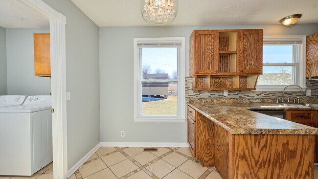 Building Photo - Now Ready : 4BR, 1 1/2BA home with fenced in back yard and storage building.