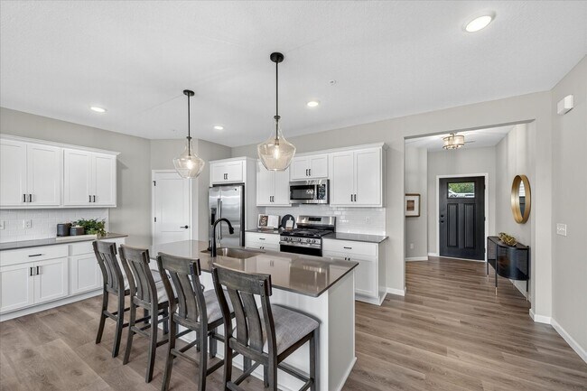 Building Photo - Westview townhome plan in Corcoran’s Hope Meadows community—a brand-new townhome development near...